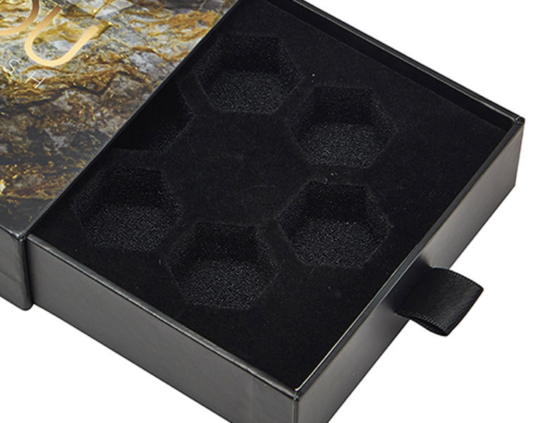 Precision die-cut foam insert protecting cosmetic vials Precision die-cut foam insert protecting cosmetic vials